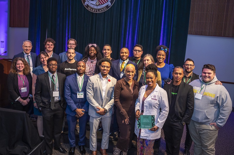 Smiling Demo Day winners pose for a photo at Loyola after the event