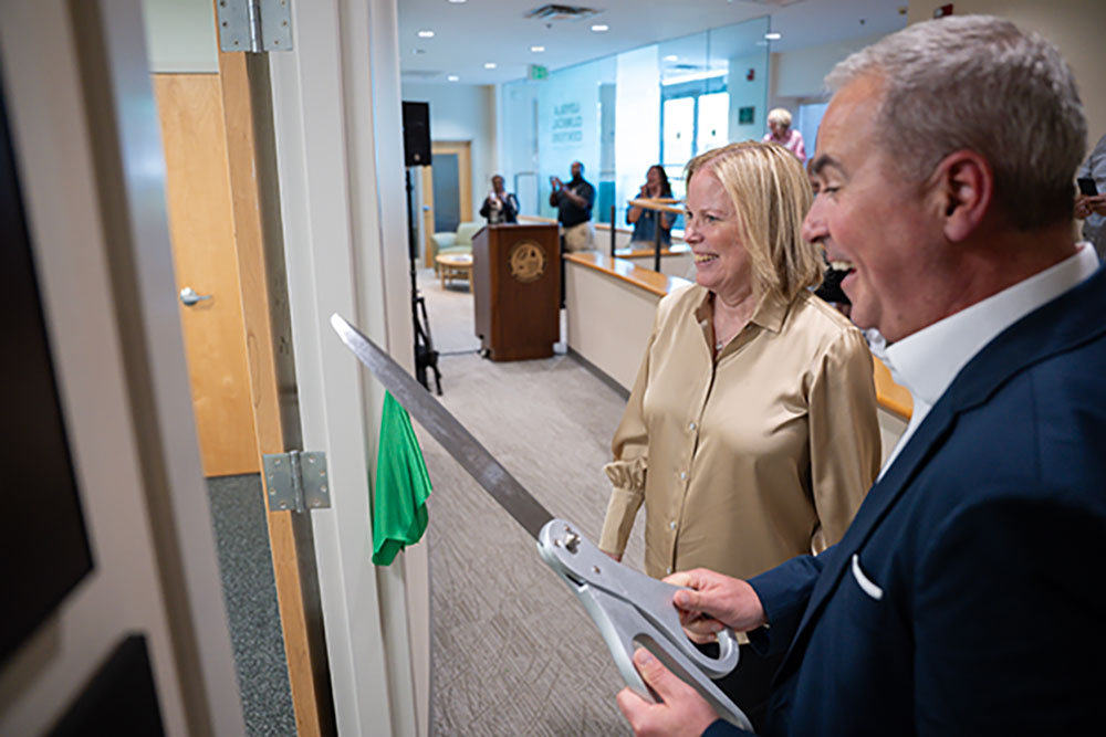 Lisa Higgins Hussman and Terrence M. Sawyer, J.D., cut the ribbon at the grand opening of the Lisa Higgins Hussman Foundation Pediatric Playroom at the Loyola Clinical Centers on June 4, 2025 (Ryan Heibler, '25).