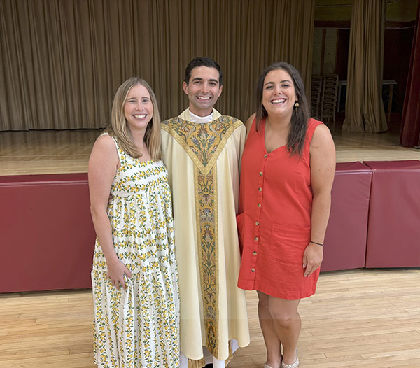 Laura McCormack, ’14, associate director for liturgy and music, the Rev. Jonathan Pennacchia, S.J., '14, and Emily Kane, ’14, director for campus ministry.