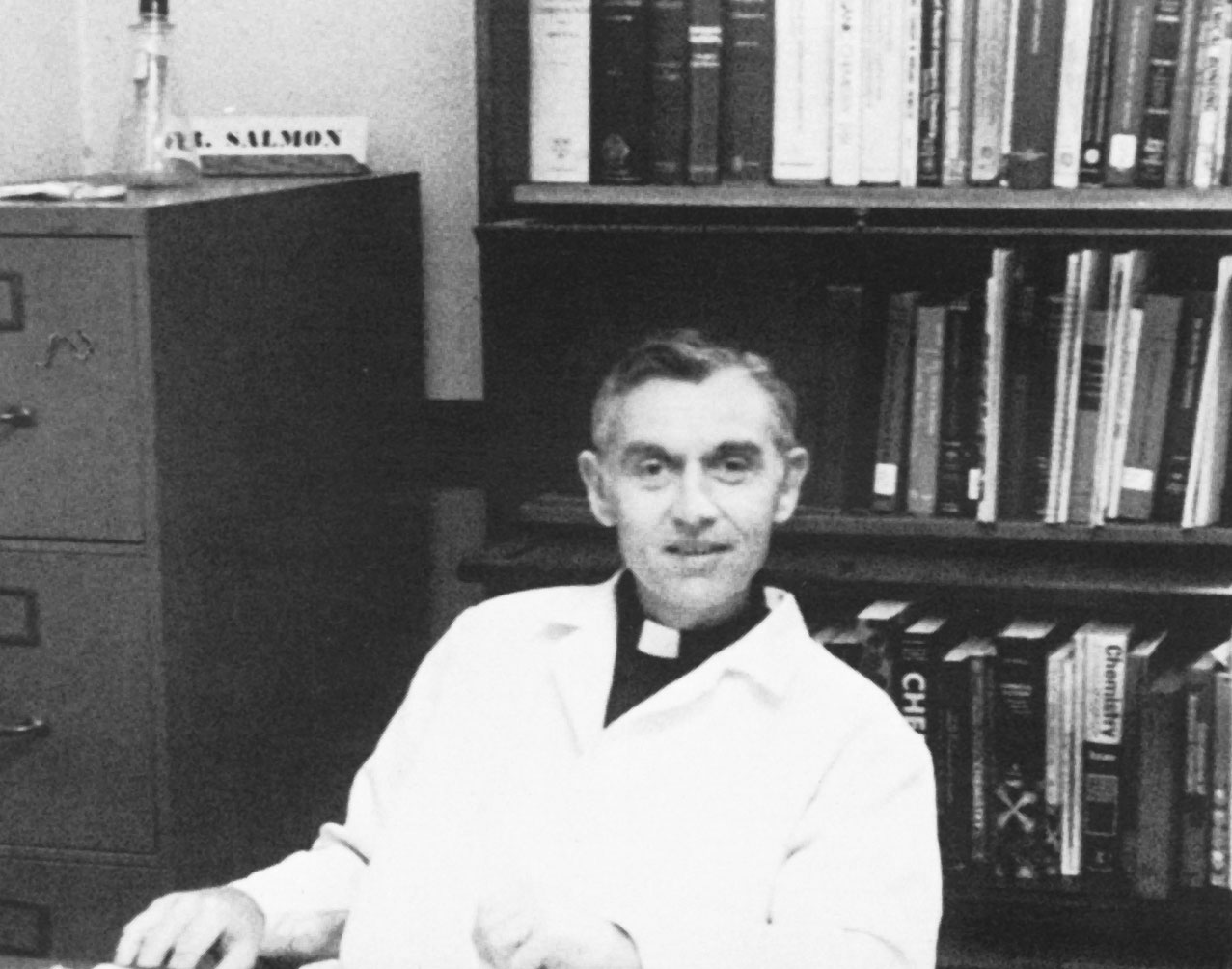 Fr. Salmon sits in his office in 1973.