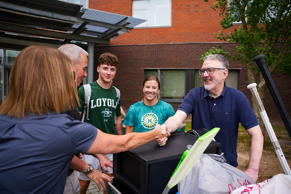 President Sawyer and his wife, Courtney, greet new students and their families on move-in day