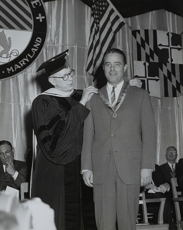 Sargent Shriver receives the Andrew White Medal from the Rev. Vincent F. Beatty, S.J., 22nd president of Loyola, in 1964 (Loyola Notre Dame Library Archives and Special Collections)