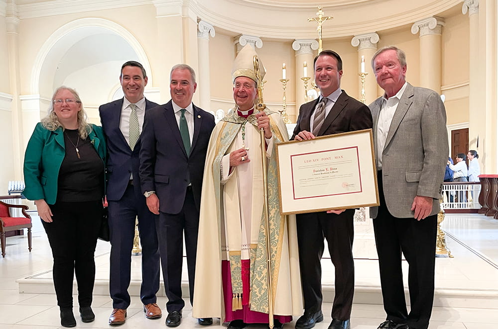 Trustee Dan Rizzo with Archbishop of Baltimore William E. Lori, President Terry Sawyer, and Loyola colleagues including Brian Oakes and Rita Buettner