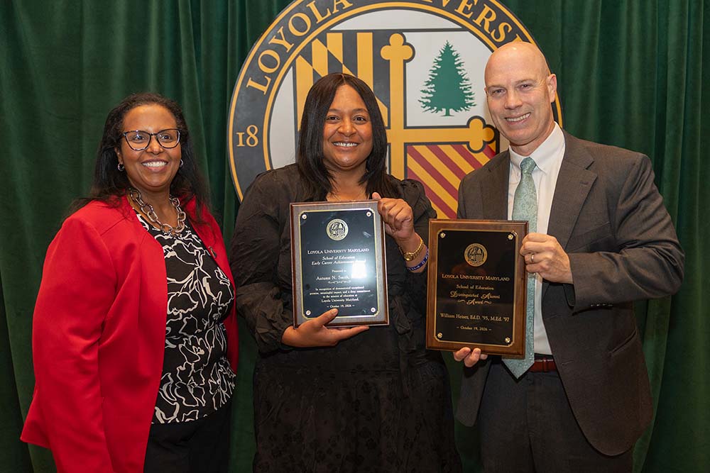 Dean Afra Hersi, Ph.D., stands for a photo with William Heiser, Ed.D., ’95, M.Ed. ’97, and Autumn N. Smith, M.Ed. ’16