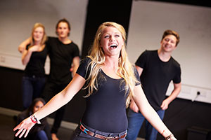 Woman singing on stage