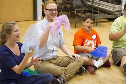 Loyola students talking with children