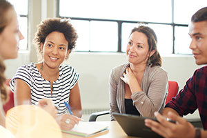 Montessori graduate students working together in a group