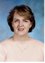 Headshot of a woman with short brown hair