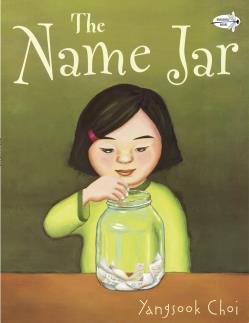 Book cover of 'The Name Jar' showing a girl reaching into a jar with several slips of paper