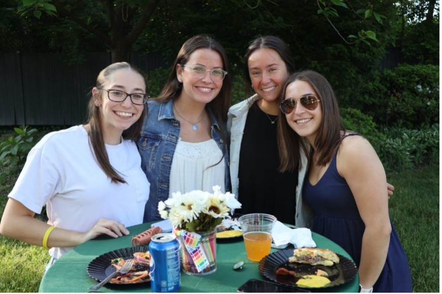 4 education majors celebrating after pinning ceremony