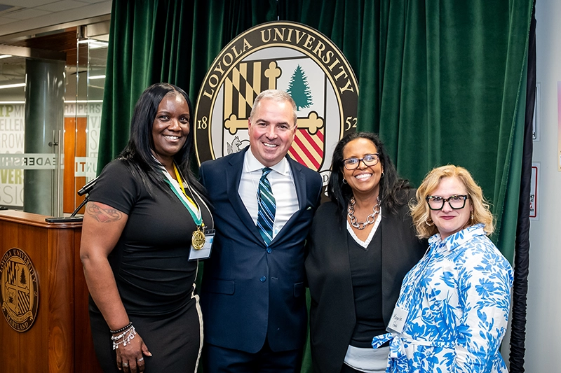Multiple people pose for a picture at the Emerging Scholars event at Loyola University Maryland.