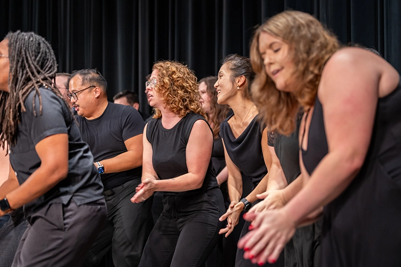 American Kodály Institute students perform during their summer concert dressed in all black.