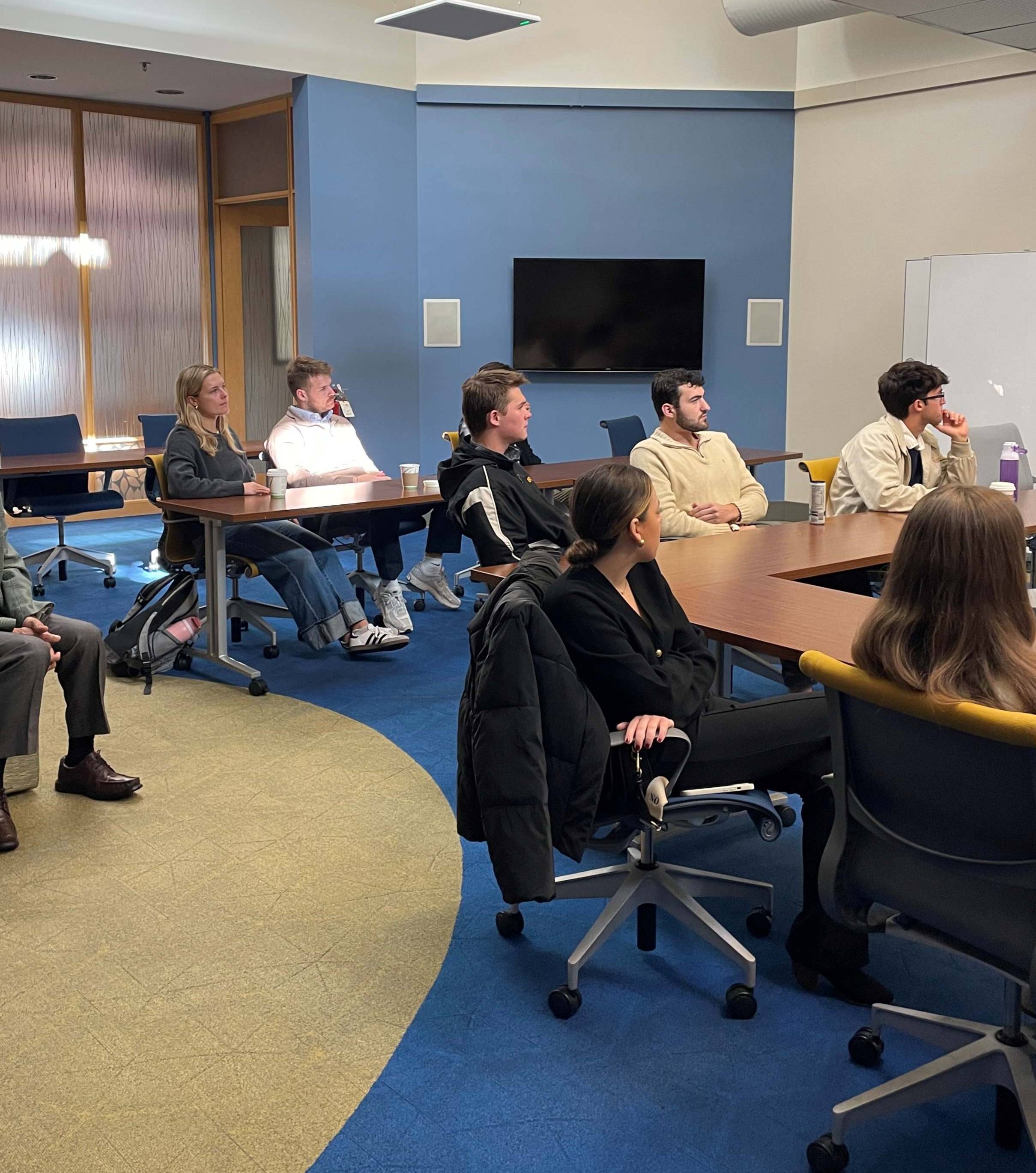 Loyola students listening to a group of panelists at McCormick