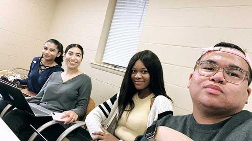Students taking a selfie together during practice.