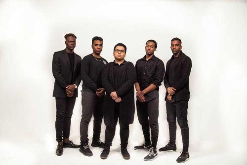 Male models posing against a white background wearing all black.