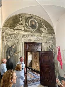 An ornate doorway with religious paintings