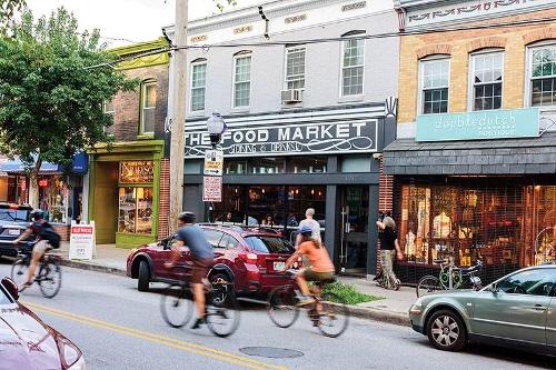 People riding bikes on a street in Baltimore