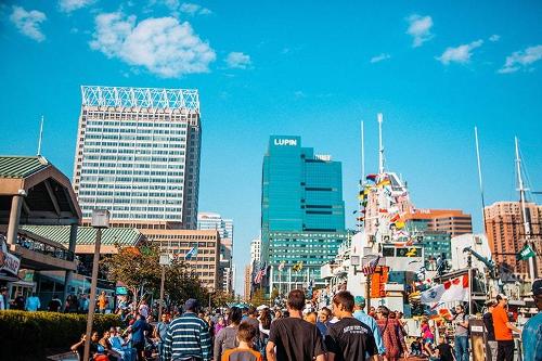 A crowd in front buildings in Downtown Baltimore