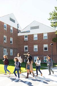 Students walk outside a residence hall
