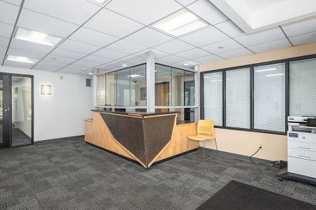 A room with a set of glass paneled windows