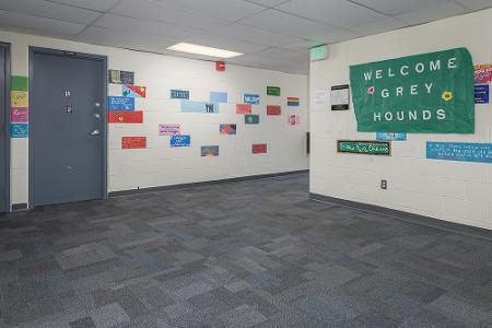 Dorothy Day wall mural and Loyola flag hanging on the wall