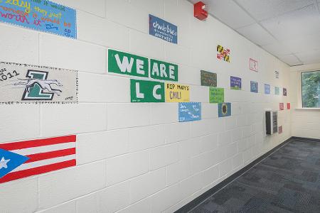 Dorothy Day wall mural with painted Loyola tiles