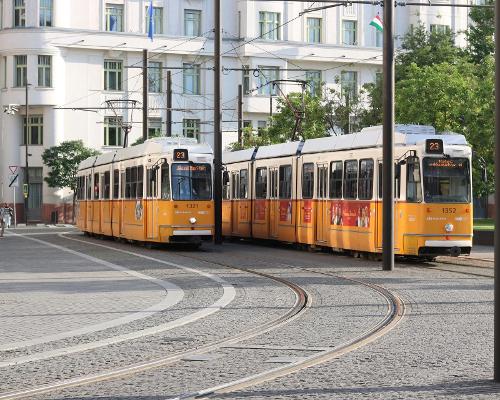 wo yellow Budapest trams on city tracks in Budapest, Hungary