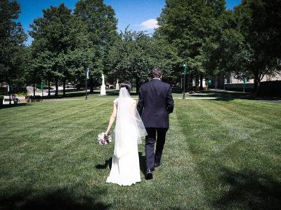 Married couple walking on the Quad