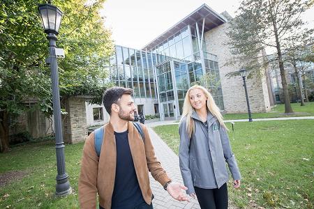 Two students chat as they depart from Donnelly Science Center.