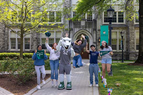 A group of students and Iggy celebrate how awesome it is to be a Loyola greyound